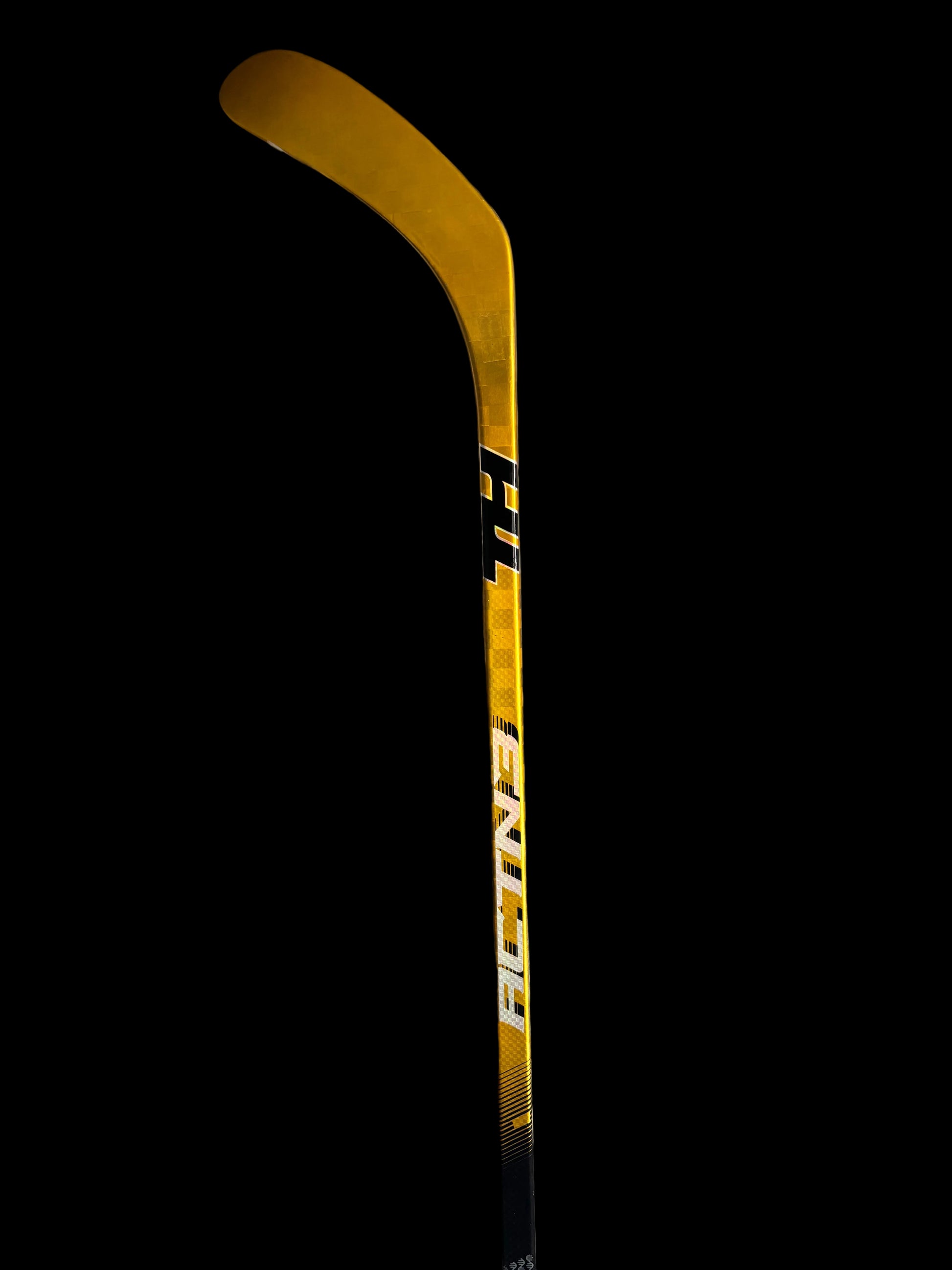Gold hockey stick Taggs Hockey