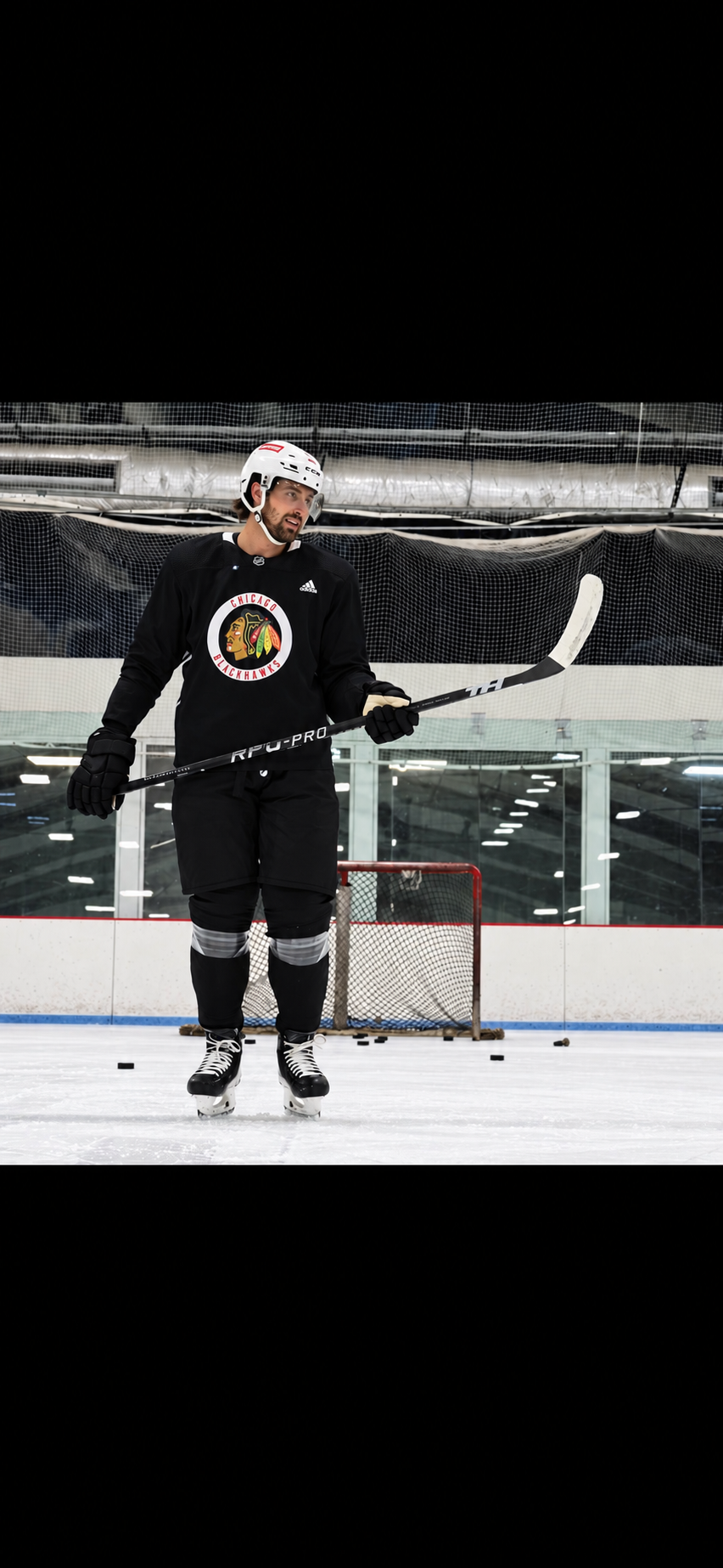 Brendan Perlini on the ice holding a Taggs Hockey RPG-PRO stick